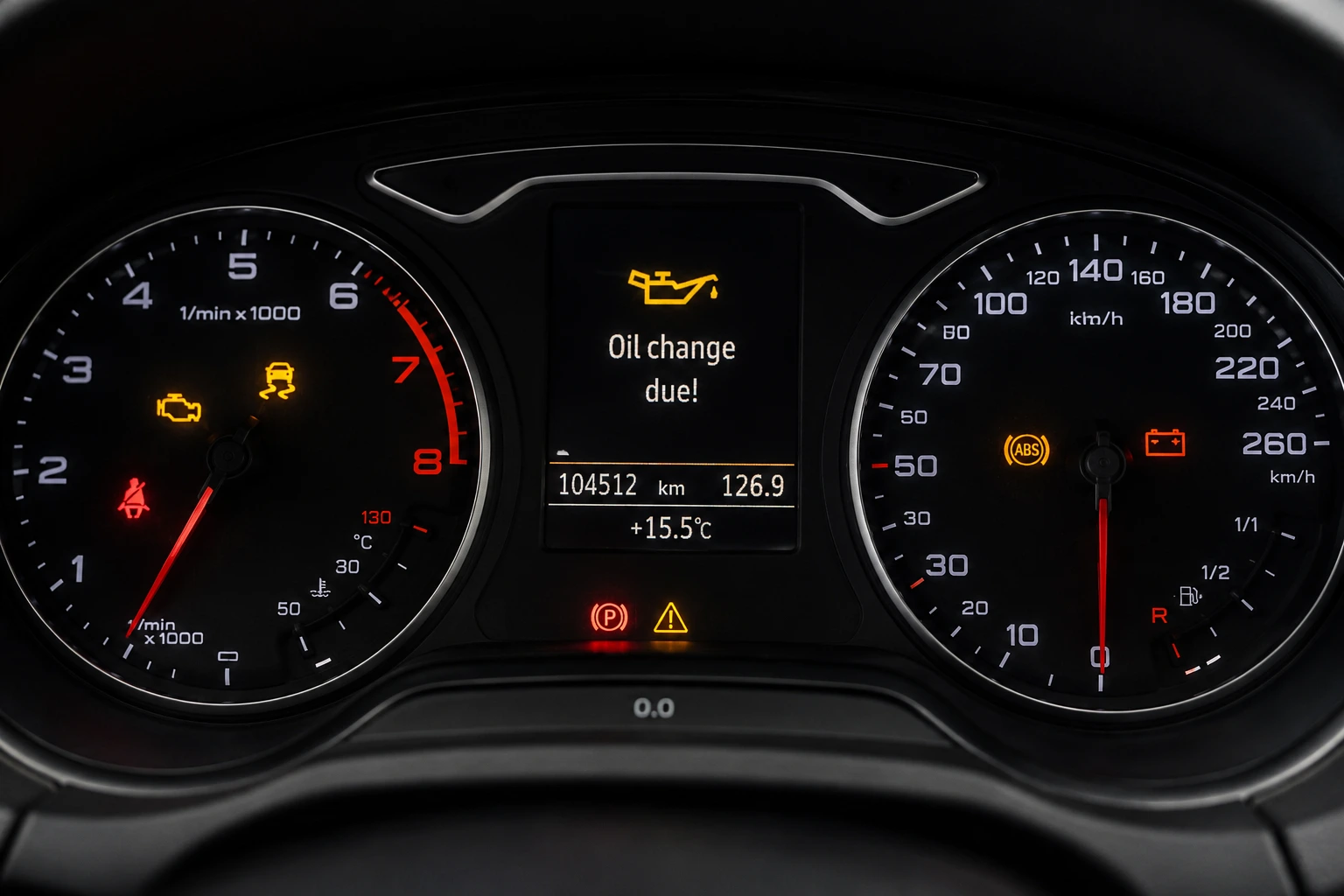 Modern car dashboard with warning lights
